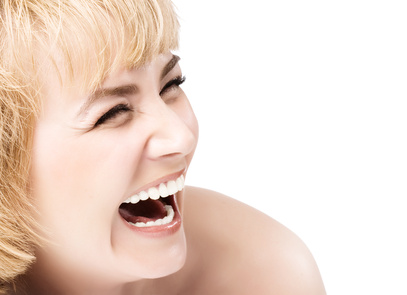 Smiling woman mouth with great teeth. Over white background